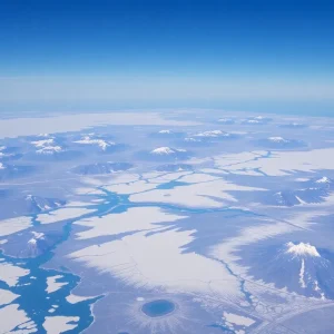 Aerial view of Greenland showcasing its icefields and rugged terrain.